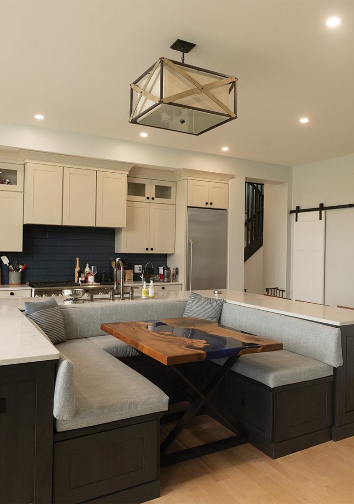 Custom kitchen with large island and seating by Woodstone Homes in Dover NH