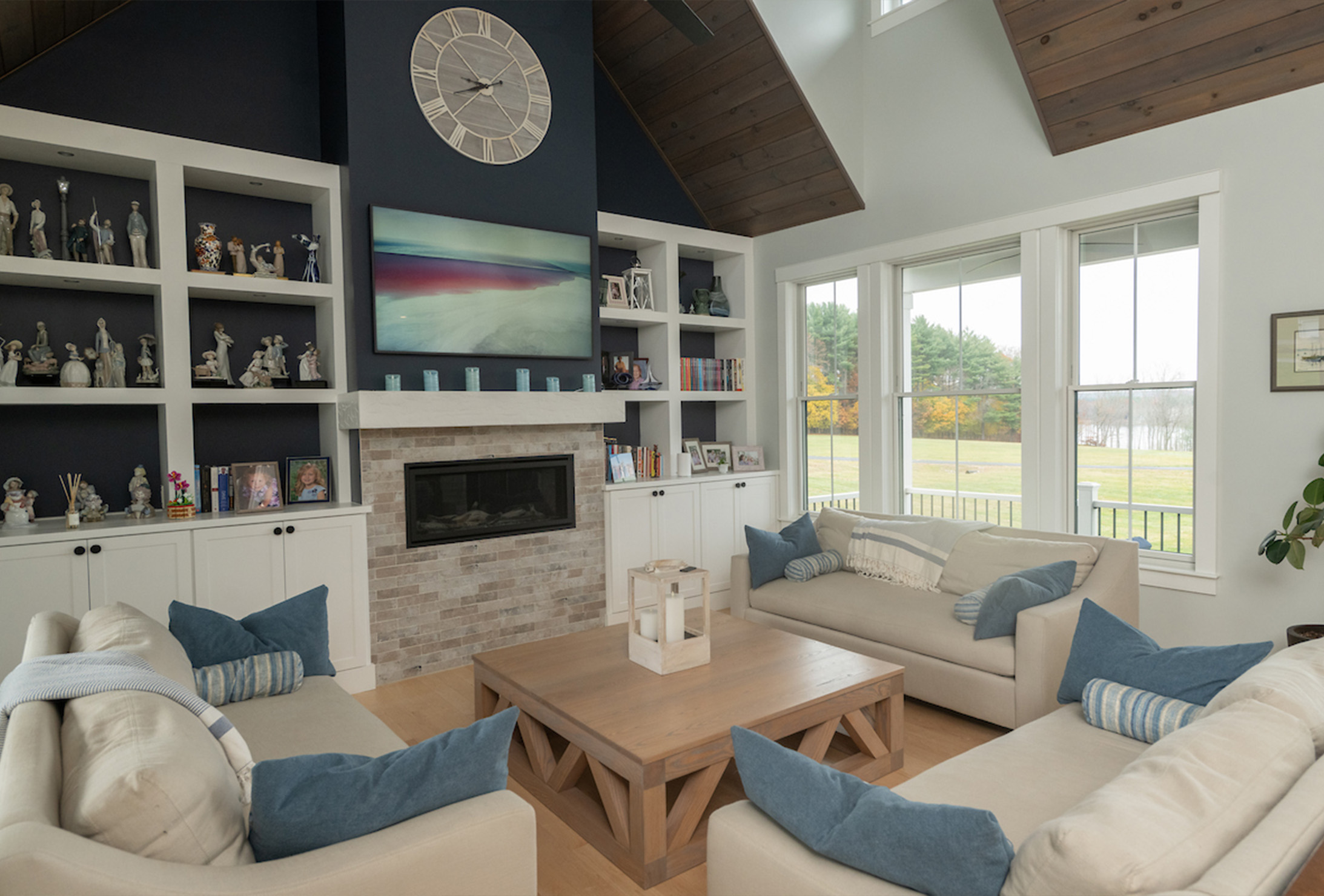 Living room with expansive outdoor views by Woodstone Homes in Dover NH