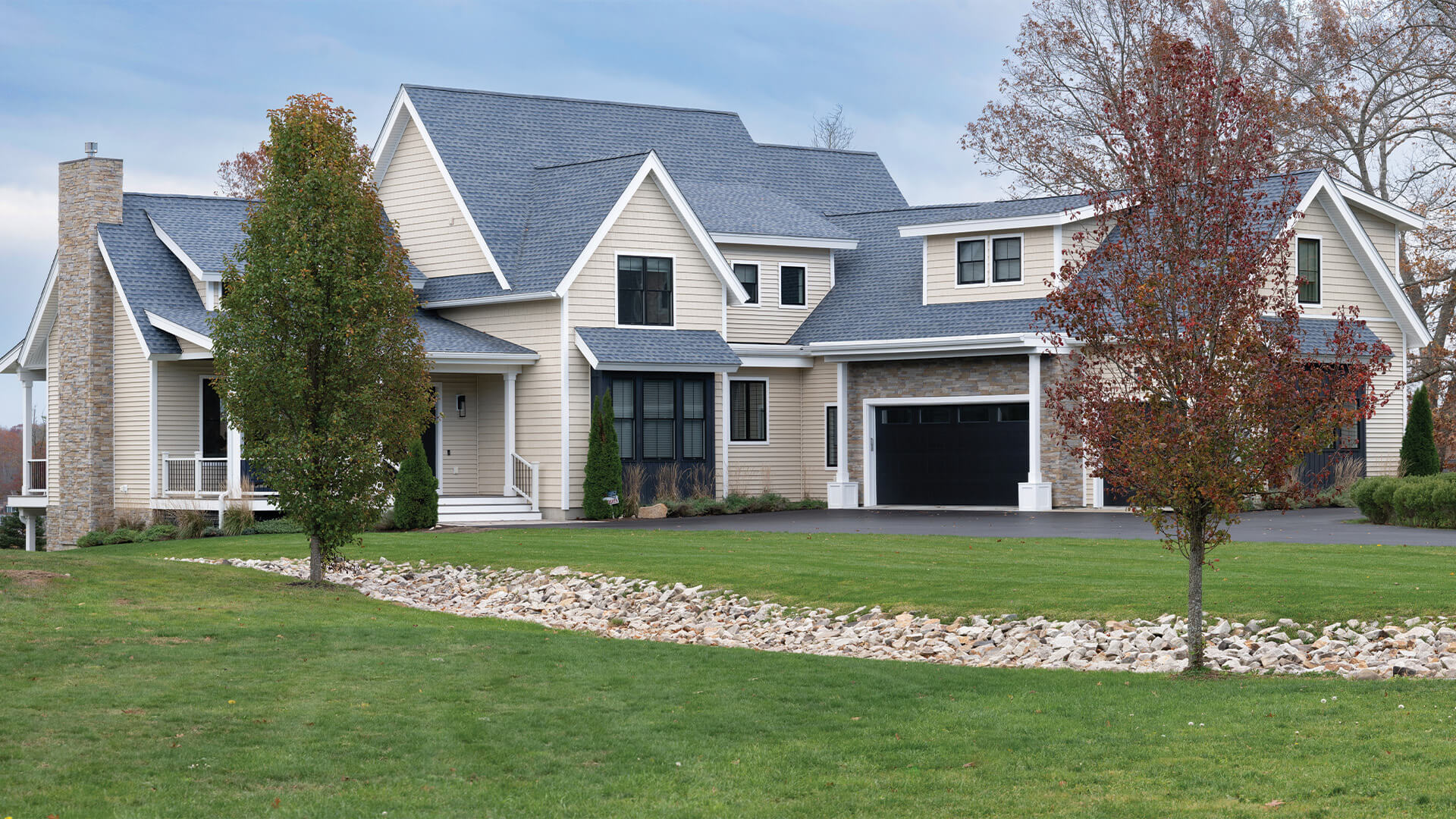 Angled exterior view of Dover custom home by Woodstone Homes