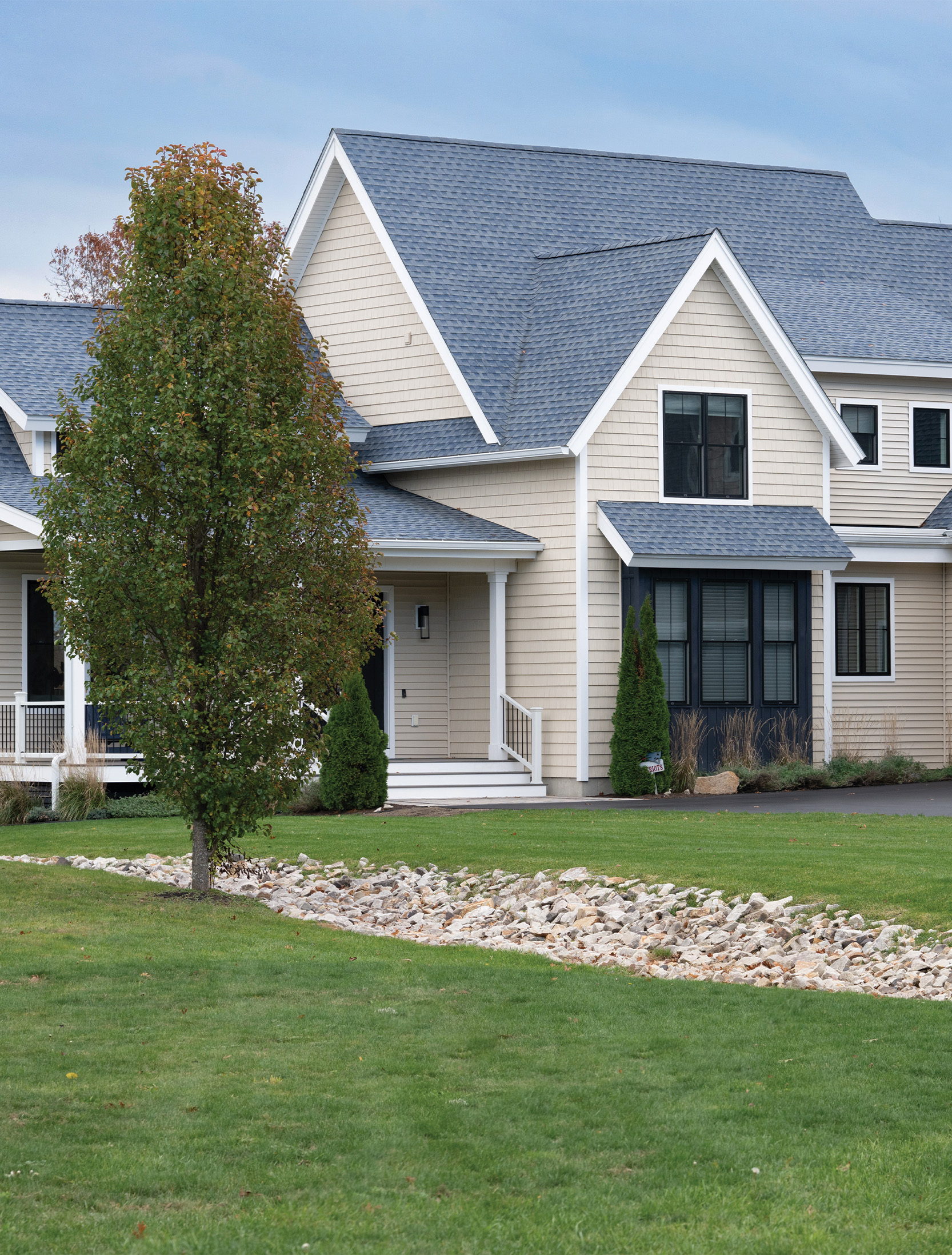 Angled exterior view of Dover custom home by Woodstone Homes